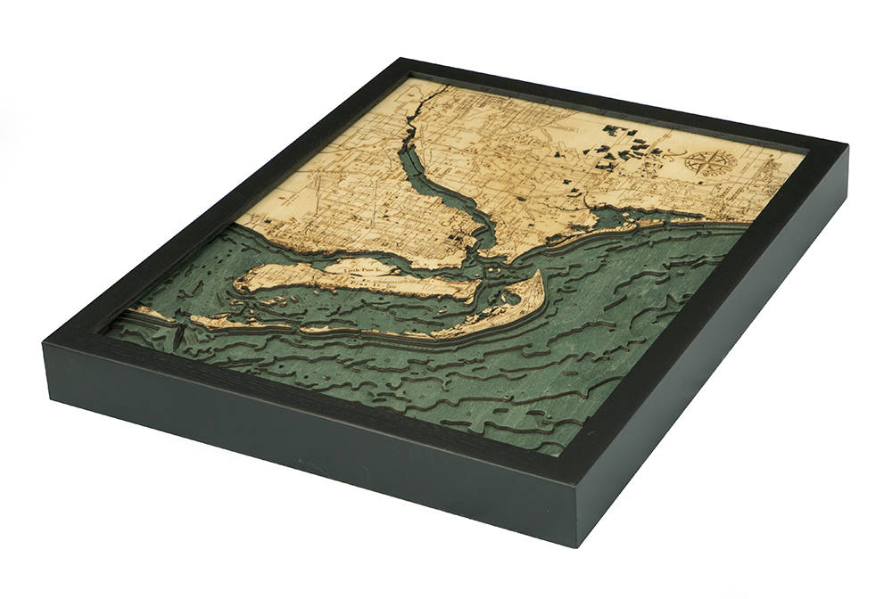 Fort Myers, Florida 3D layered wood map in laser-cut Baltic birch, shown framed against a light wall