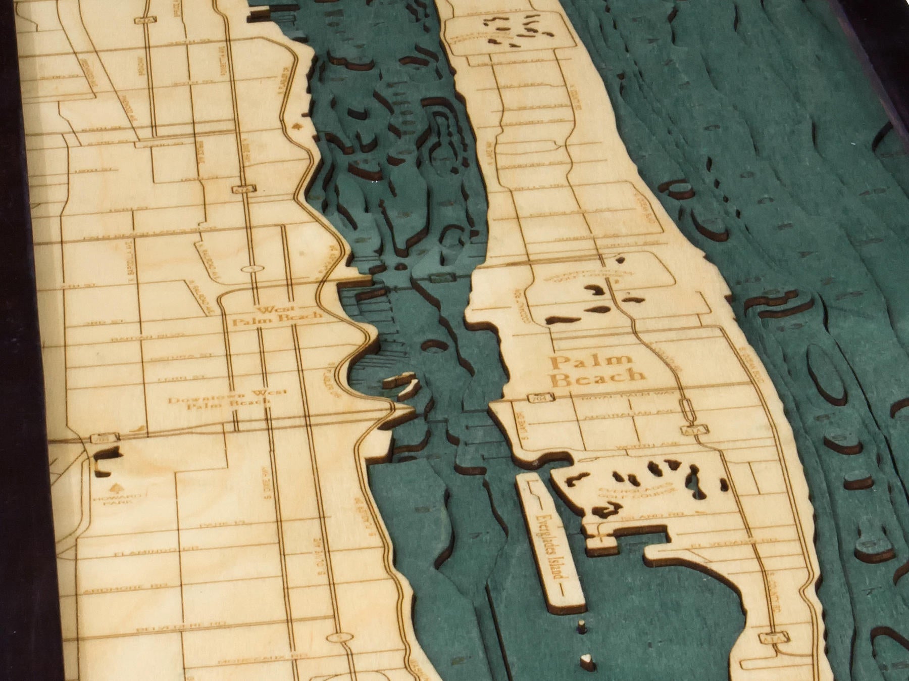 Palm Beach, Florida 3D layered wood map in laser-cut Baltic birch, shown framed against a light wall
