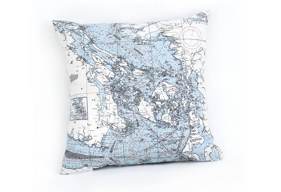 San Juan Islands, Washington nautical pillow in laser-cut Baltic birch, shown framed against a light wall