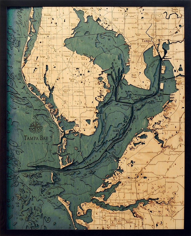 Tampa Bay, Florida 3D layered wood map in laser-cut Baltic birch, shown framed against a light wall