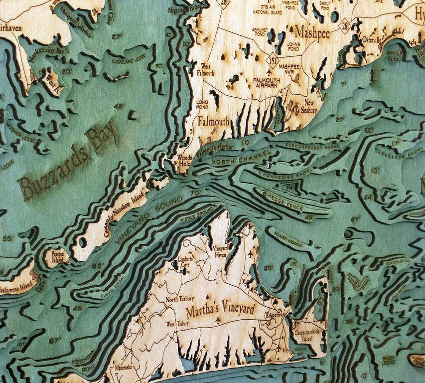 Cape Cod, Massachusetts 3D layered wood map in laser-cut Baltic birch, shown framed against a light wall