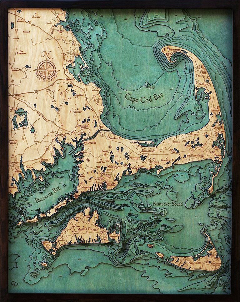 Cape Cod, Massachusetts 3D layered wood map in laser-cut Baltic birch, shown framed against a light wall