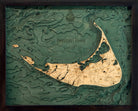 Nantucket, Massachusetts 3D layered wood map in laser-cut Baltic birch, shown framed against a light wall