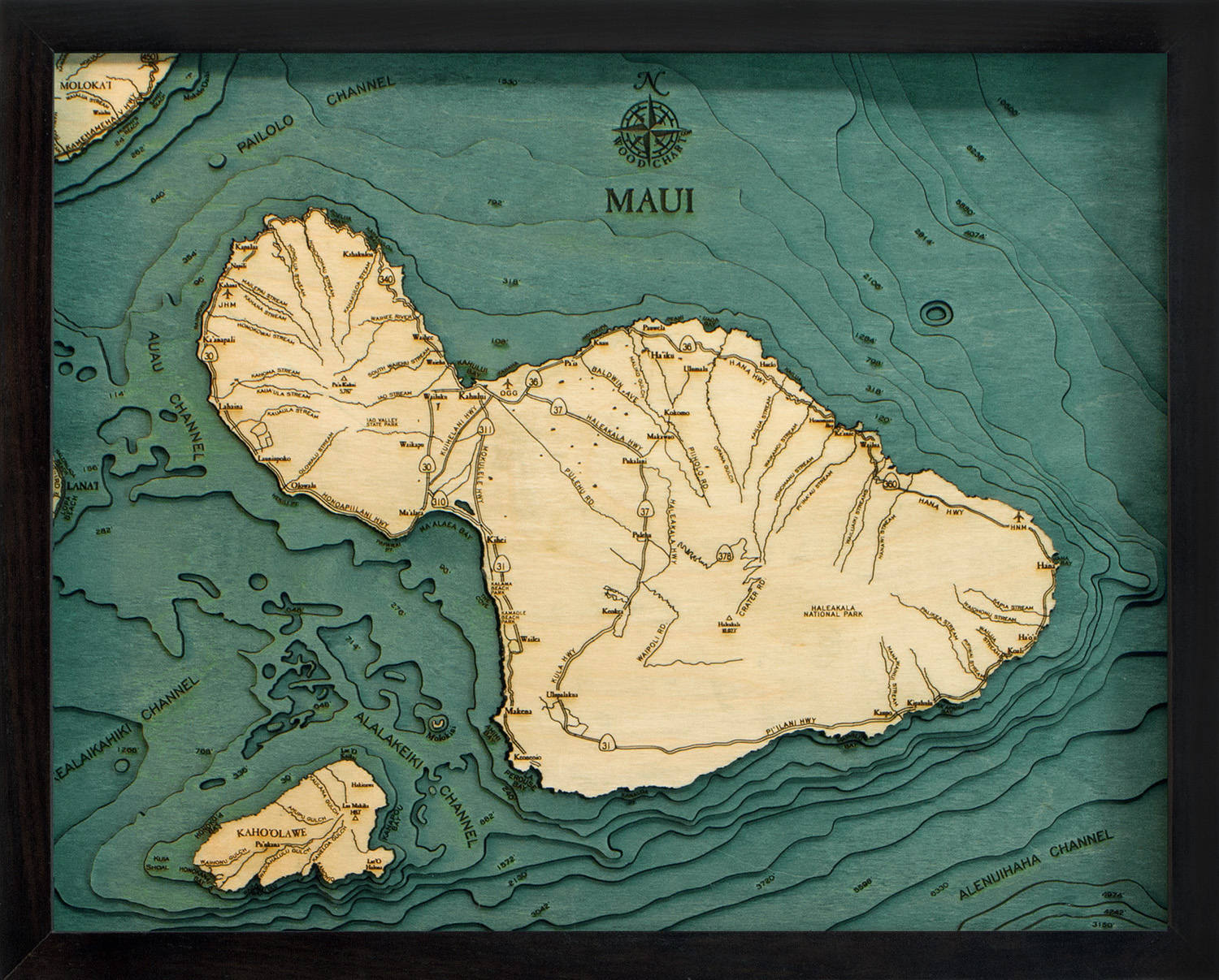 Maui, Hawaii 3D layered wood map in laser-cut Baltic birch, shown framed against a light wall