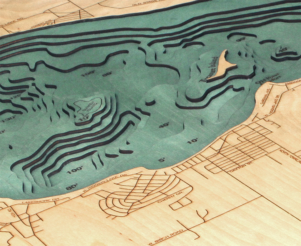 Higgins Lake, Michigan 3D layered wood map in laser-cut Baltic birch, shown framed against a light wall