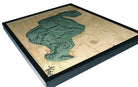 Houghton Lake, Michigan 3D layered wood map in laser-cut Baltic birch, shown framed against a light wall