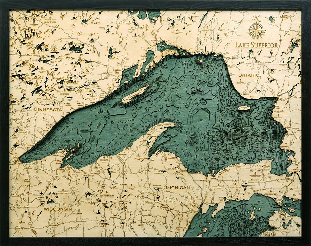 Lake Superior, Michigan 3D layered wood map in laser-cut Baltic birch, shown framed against a light wall