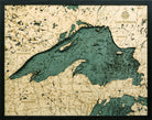 Lake Superior, Michigan 3D layered wood map in laser-cut Baltic birch, shown framed against a light wall