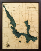 Walloon Lake, Michigan 3D layered wood map in laser-cut Baltic birch, shown framed against a light wall