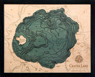 Crater Lake, Oregon 3D layered wood map in laser-cut Baltic birch, shown framed against a light wall