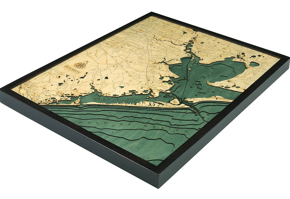 Houston, Texas 3D layered wood map in laser-cut Baltic birch, shown framed against a light wall