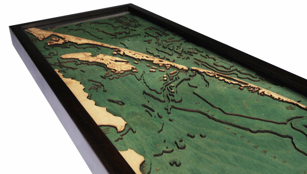 Outer Banks, North Carolina 3D layered wood map in laser-cut Baltic birch, shown framed against a light wall