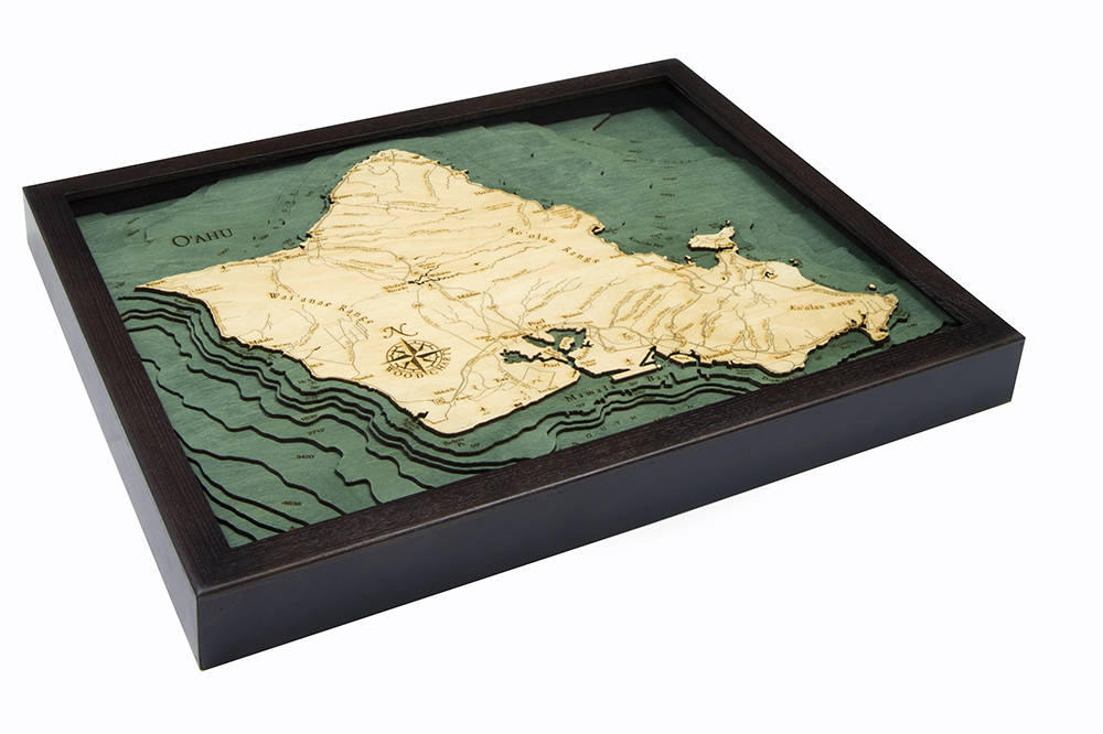 Oahu, Hawaii 3D layered wood map in laser-cut Baltic birch, shown framed against a light wall