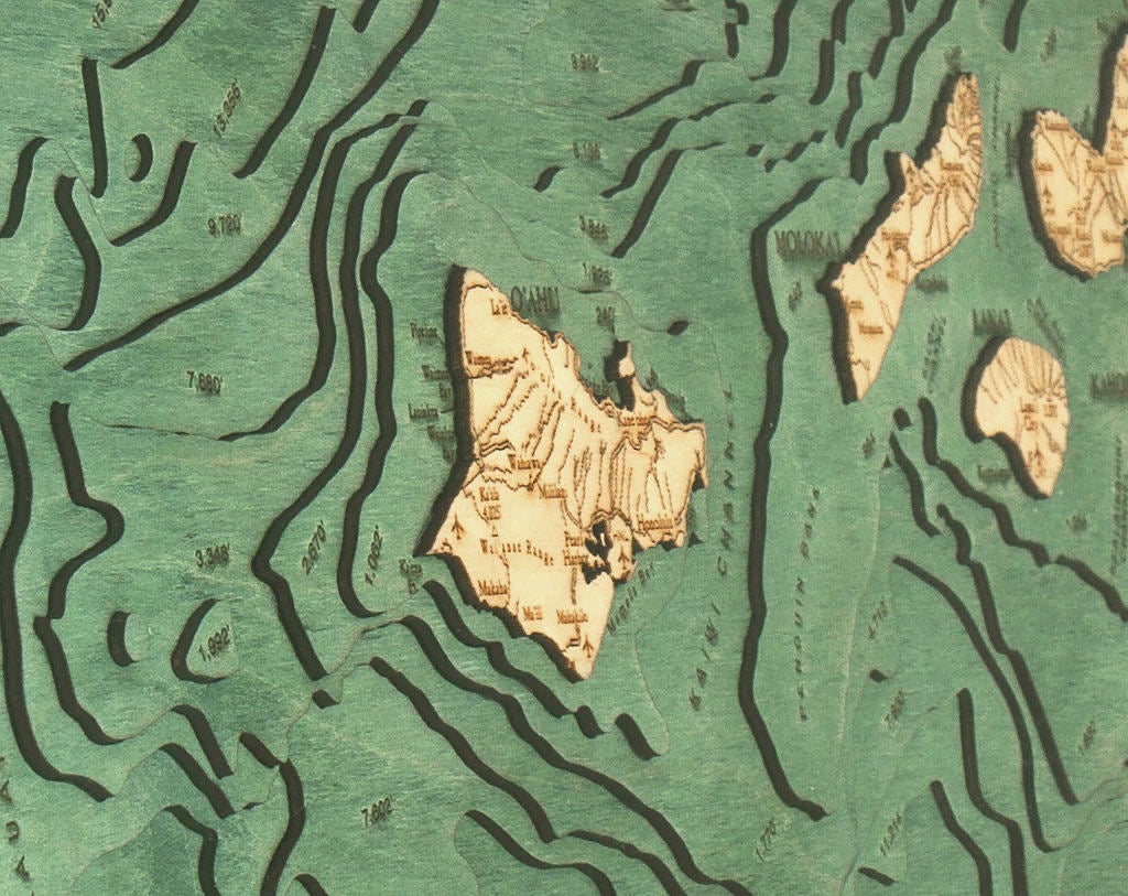 Hawaiian Islands 3D layered wood map in laser-cut Baltic birch, shown framed against a light wall