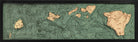 Hawaiian Islands 3D layered wood map in laser-cut Baltic birch, shown framed against a light wall