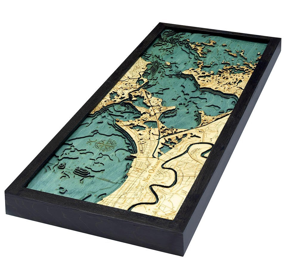 New Orleans, Louisiana 3D layered wood map in laser-cut Baltic birch, shown framed against a light wall