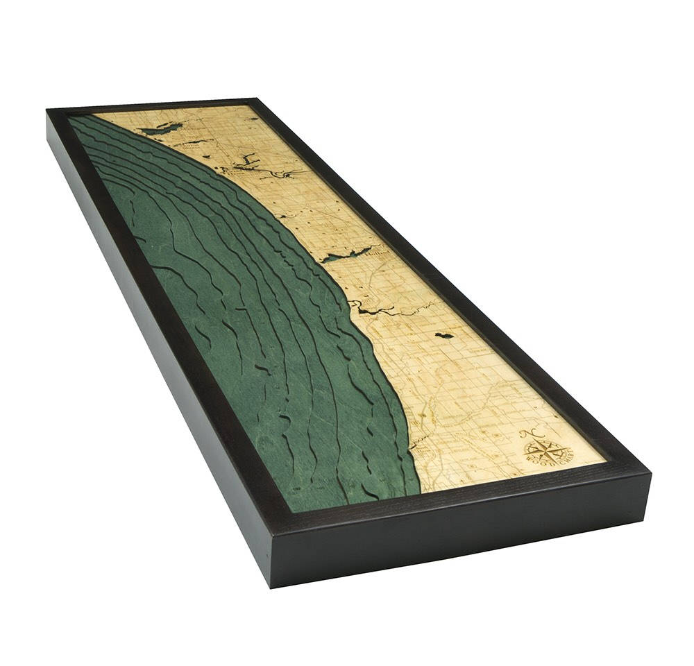 Muskegon to South Haven, Michigan 3D layered wood map in laser-cut Baltic birch, shown framed against a light wall
