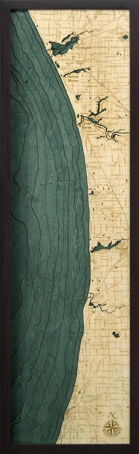 Muskegon to South Haven, Michigan 3D layered wood map in laser-cut Baltic birch, shown framed against a light wall