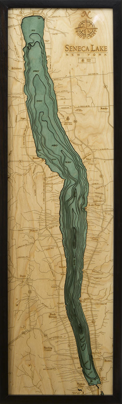Seneca Lake, New York 3D layered wood map in laser-cut Baltic birch, shown framed against a light wall