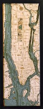 Manhattan, New York 3D layered wood map in laser-cut Baltic birch, shown framed against a light wall