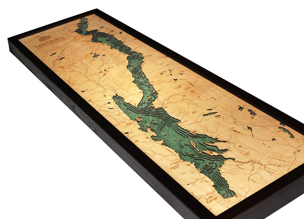 Lake George, New York 3D layered wood map in laser-cut Baltic birch, shown framed against a light wall