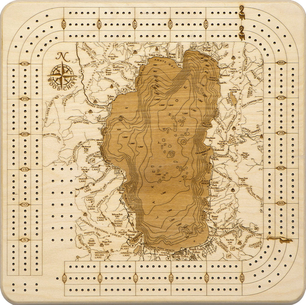 Lake Tahoe, California wood cribbage board in laser-cut Baltic birch, shown framed against a light wall