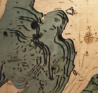 Lake Mendota & Monona, Wisconsin 3D layered wood map in laser-cut Baltic birch, shown framed against a light wall