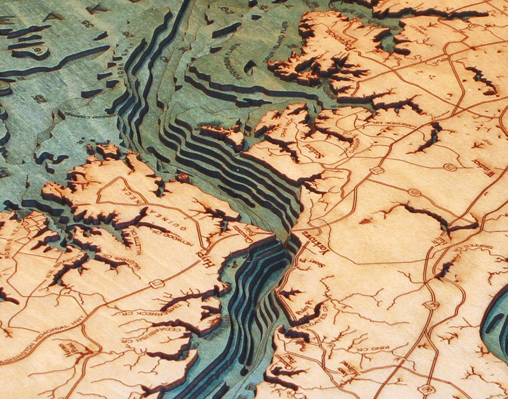 Norfolk, Virginia 3D layered wood map in laser-cut Baltic birch, shown framed against a light wall
