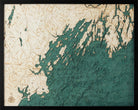 Portland, Maine 3D layered wood map in laser-cut Baltic birch, shown framed against a light wall