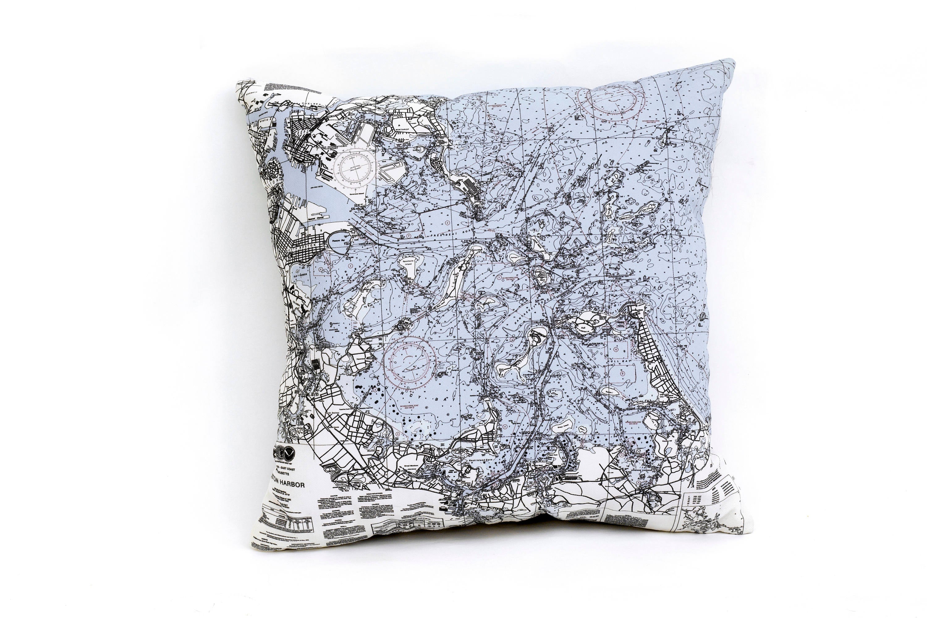 Boston Harbor, Massachusetts nautical pillow in laser-cut Baltic birch, shown framed against a light wall