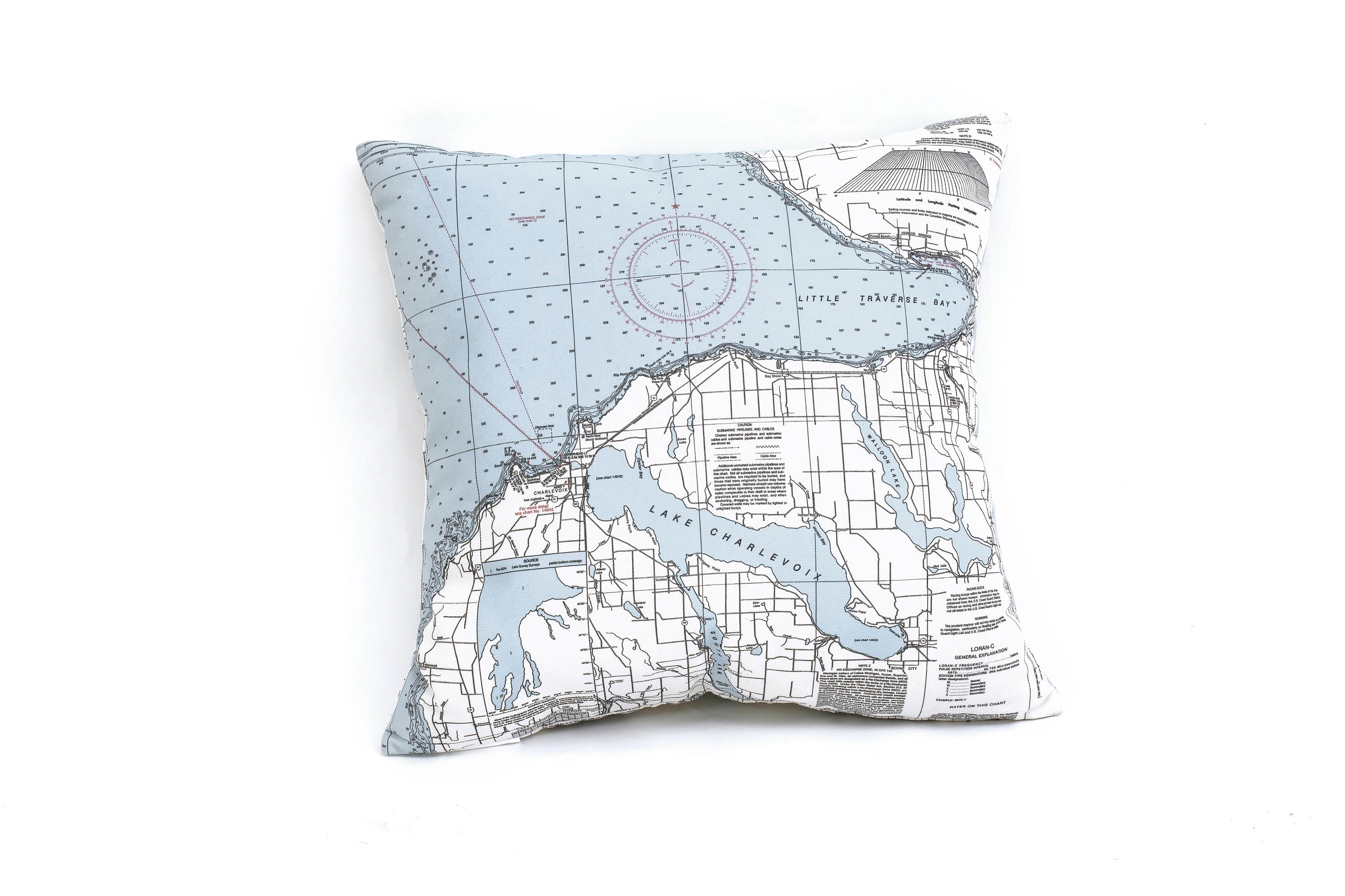 Little Traverse Bay, Michigan nautical pillow in laser-cut Baltic birch, shown framed against a light wall