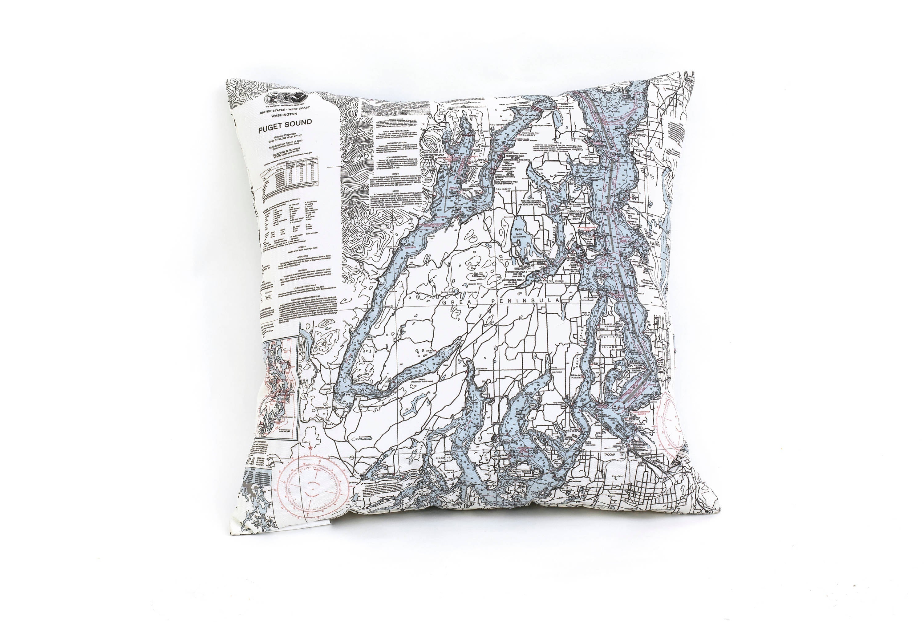 Puget Sound, Washington nautical pillow in laser-cut Baltic birch, shown framed against a light wall