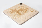 Great Lakes wood cribbage board in laser-cut Baltic birch, shown framed against a light wall