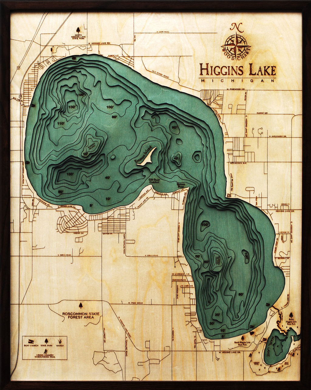 Higgins Lake, Michigan 3D layered wood map in laser-cut Baltic birch, shown framed against a light wall