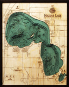 Higgins Lake, Michigan 3D layered wood map in laser-cut Baltic birch, shown framed against a light wall