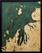 Northwest Michigan 3D layered wood map in laser-cut Baltic birch, shown framed against a light wall
