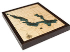 Walloon Lake, Michigan 3D layered wood map in laser-cut Baltic birch, shown framed against a light wall