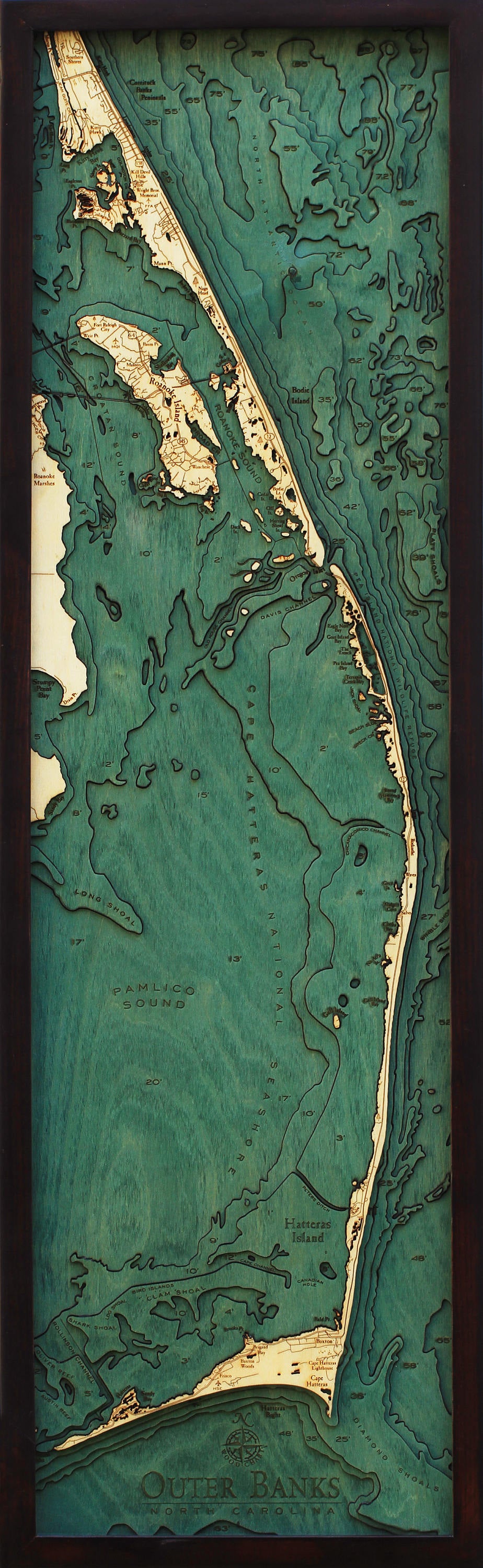 Outer Banks, North Carolina 3D layered wood map in laser-cut Baltic birch, shown framed against a light wall