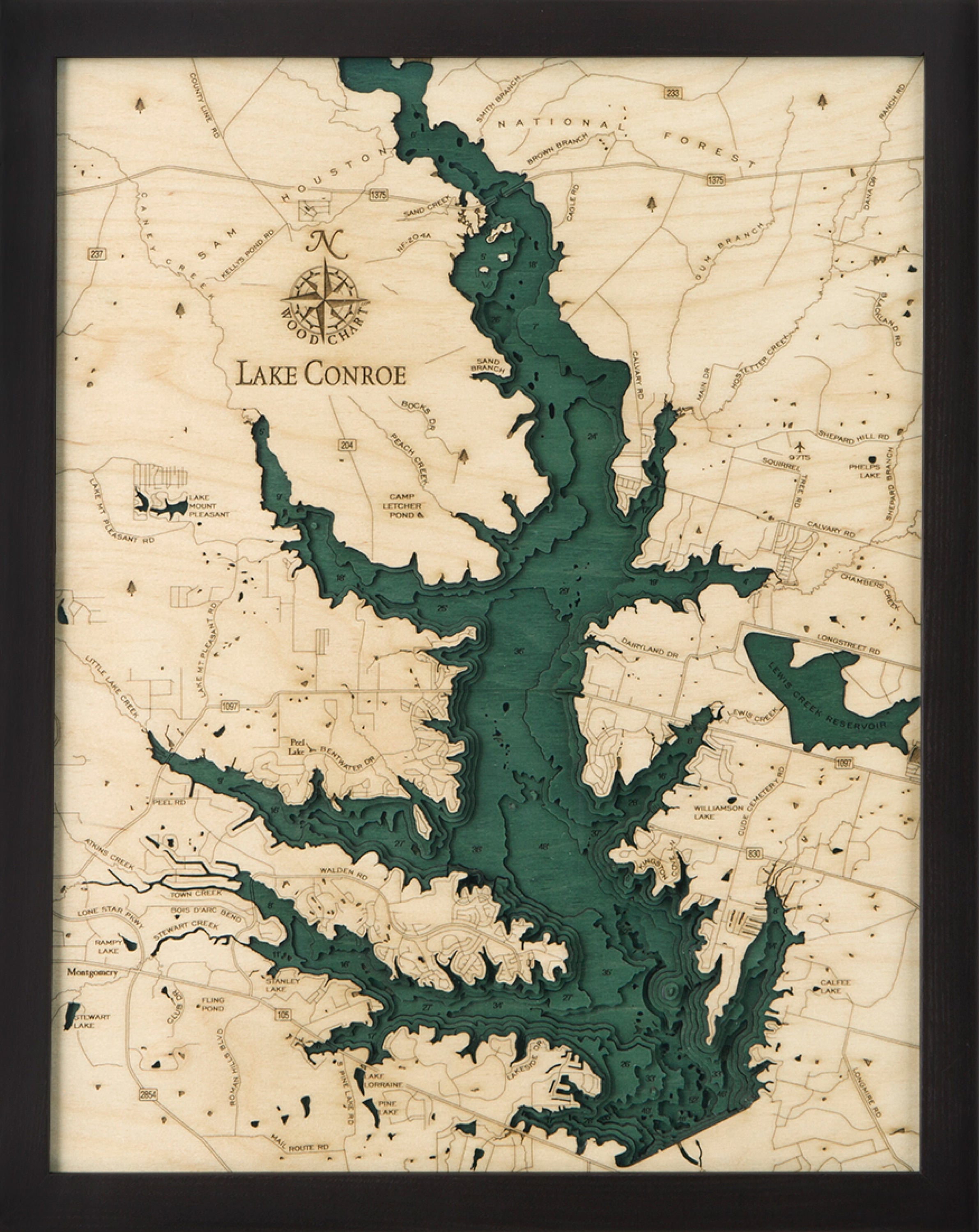 Lake Conroe, Texas 3D layered wood map in laser-cut Baltic birch, shown framed against a light wall