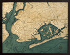 Brooklyn, New York 3D layered wood map in laser-cut Baltic birch, shown framed against a light wall
