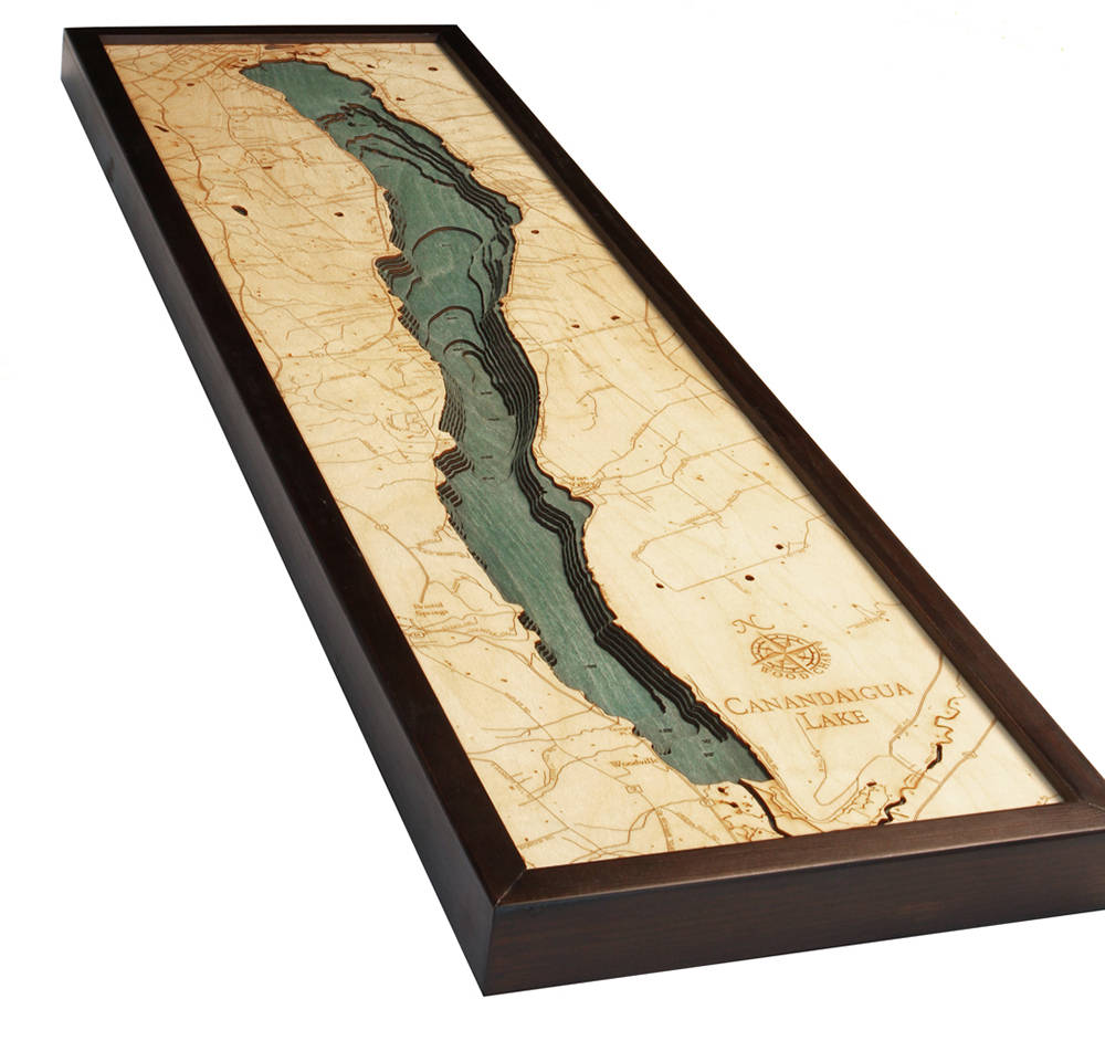 Canandaigua Lake, New York 3D layered wood map in laser-cut Baltic birch, shown framed against a light wall