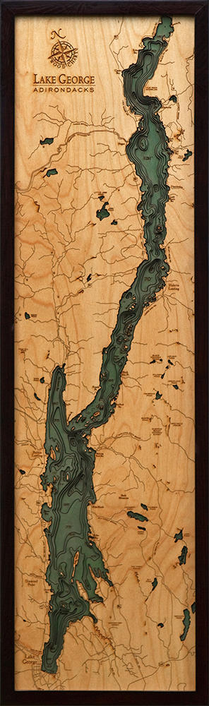Lake George, New York 3D layered wood map in laser-cut Baltic birch, shown framed against a light wall