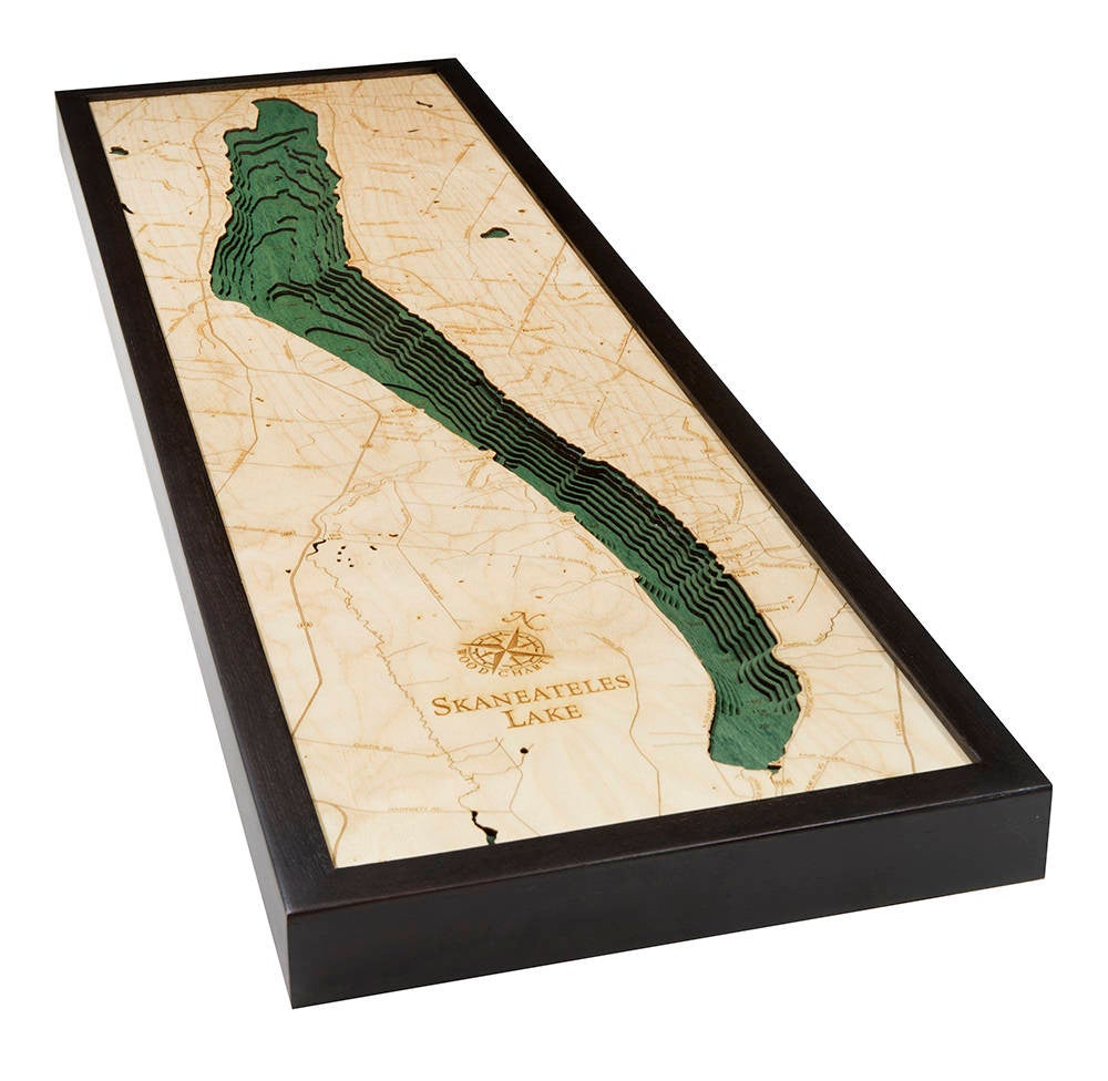 Lake Skaneateles, New York 3D layered wood map in laser-cut Baltic birch, shown framed against a light wall