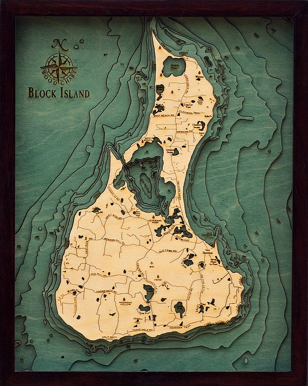Block Island, Rhode Island 3D layered wood map in laser-cut Baltic birch, shown framed against a light wall