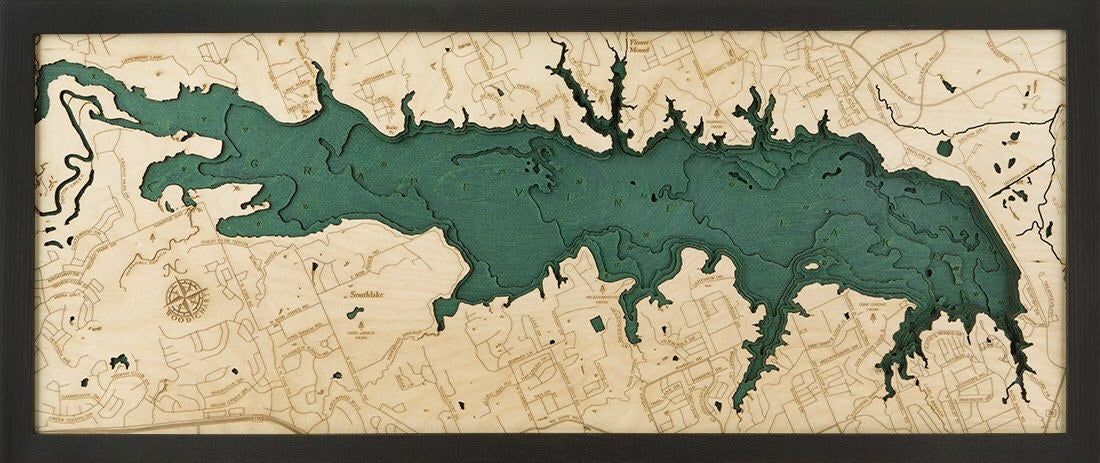 Grapevine Lake, Texas 3D layered wood map in laser-cut Baltic birch, shown framed against a light wall