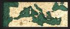Mediterranean Sea 3D layered wood map in laser-cut Baltic birch, shown framed against a light wall