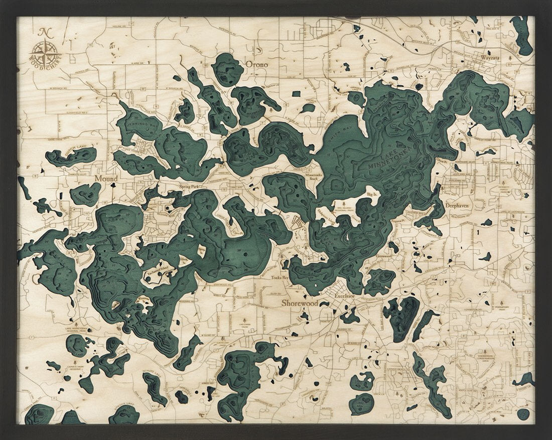Lake Minnetonka, Minnesota 3D layered wood map in laser-cut Baltic birch, shown framed against a light wall