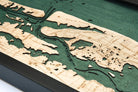 Saint Augustine, Florida 3D layered wood map in laser-cut Baltic birch, shown framed against a light wall