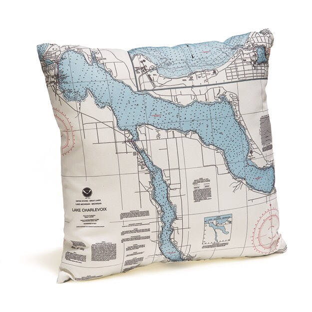 Lake Charlevoix, Michigan nautical pillow in laser-cut Baltic birch, shown framed against a light wall