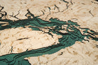 Salish Sea, Washington 3D layered wood map in laser-cut Baltic birch, shown framed against a light wall